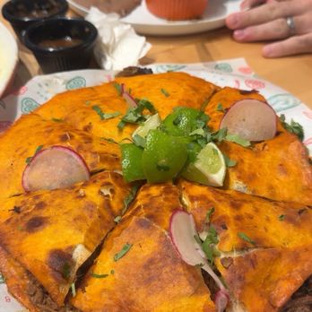 918 Maples Tacos & Cantina signature dishes Birria PizzaWet BurritoEmpanadas